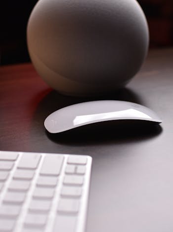 Wireless Mouse on Wooden Table